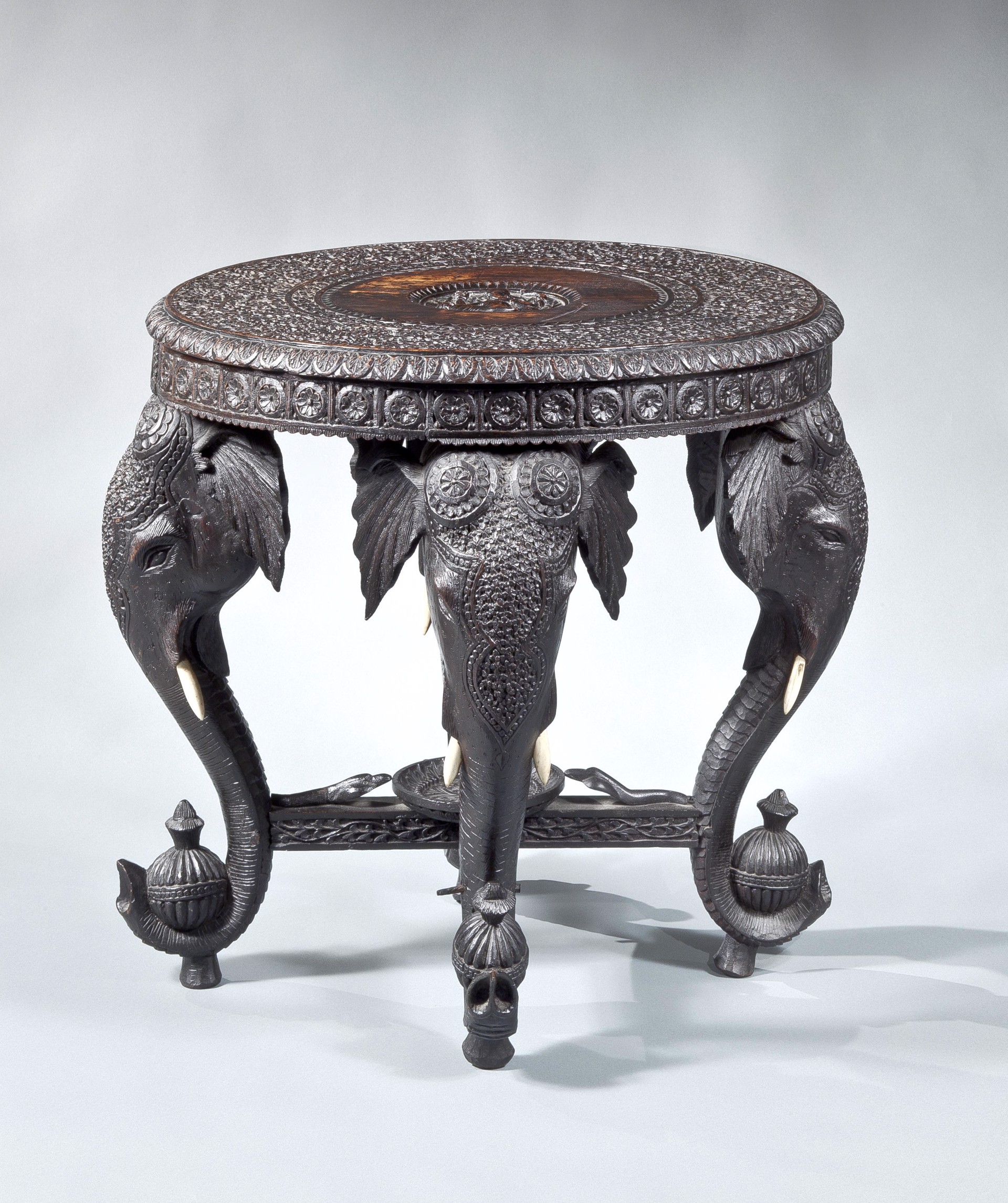 INDIAN CARVED HARDWOOD CIRCULAR SIDE TABLE