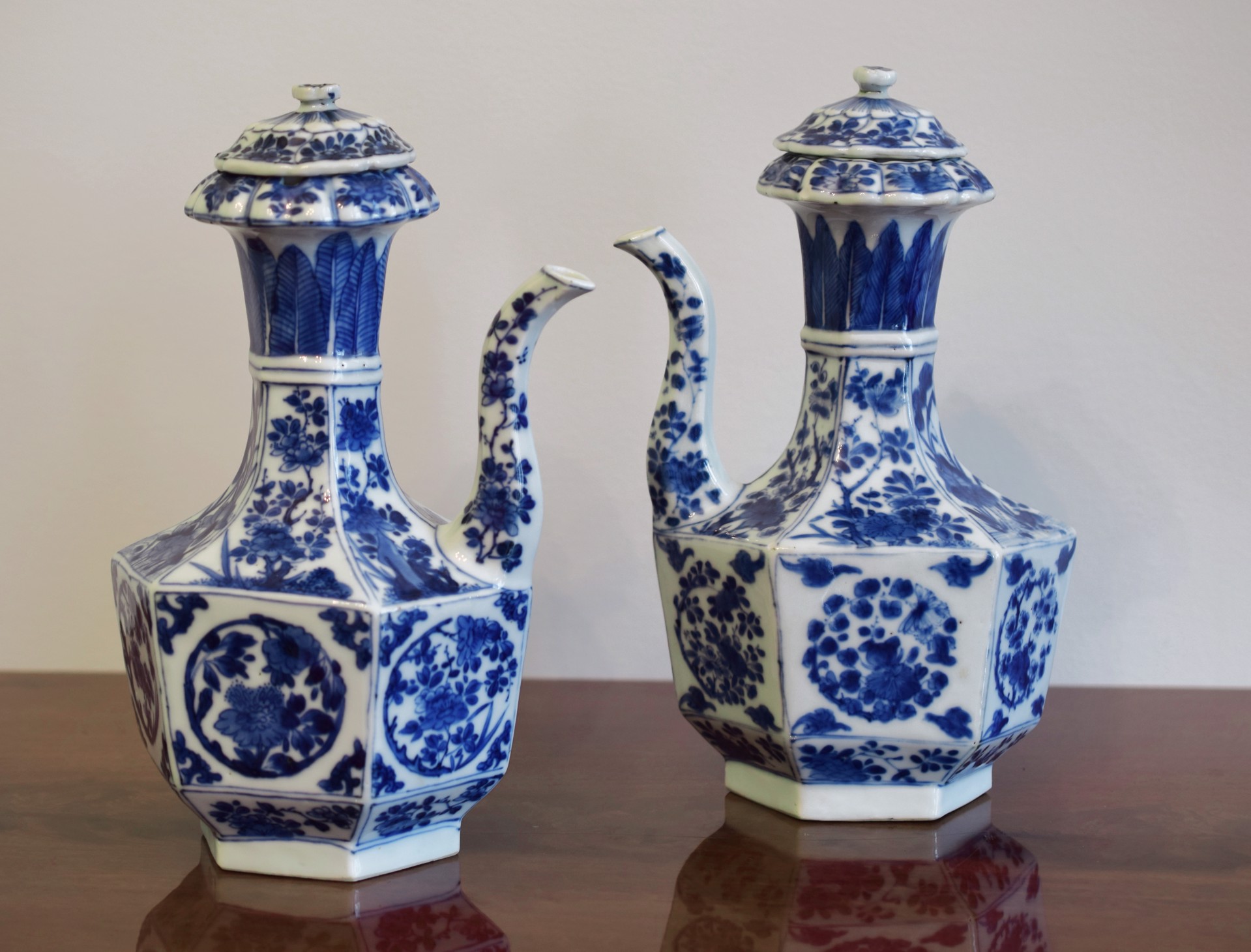 PAIR OF BLUE AND WHITE EWERS WITH COVERS