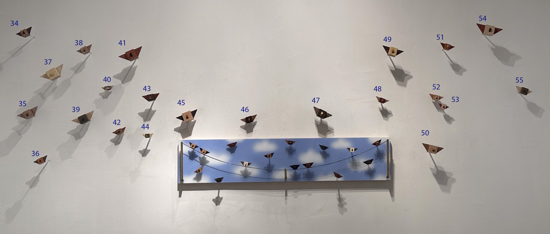The Flock (Master bedroom installation of 40 birds) by Brendan Flores