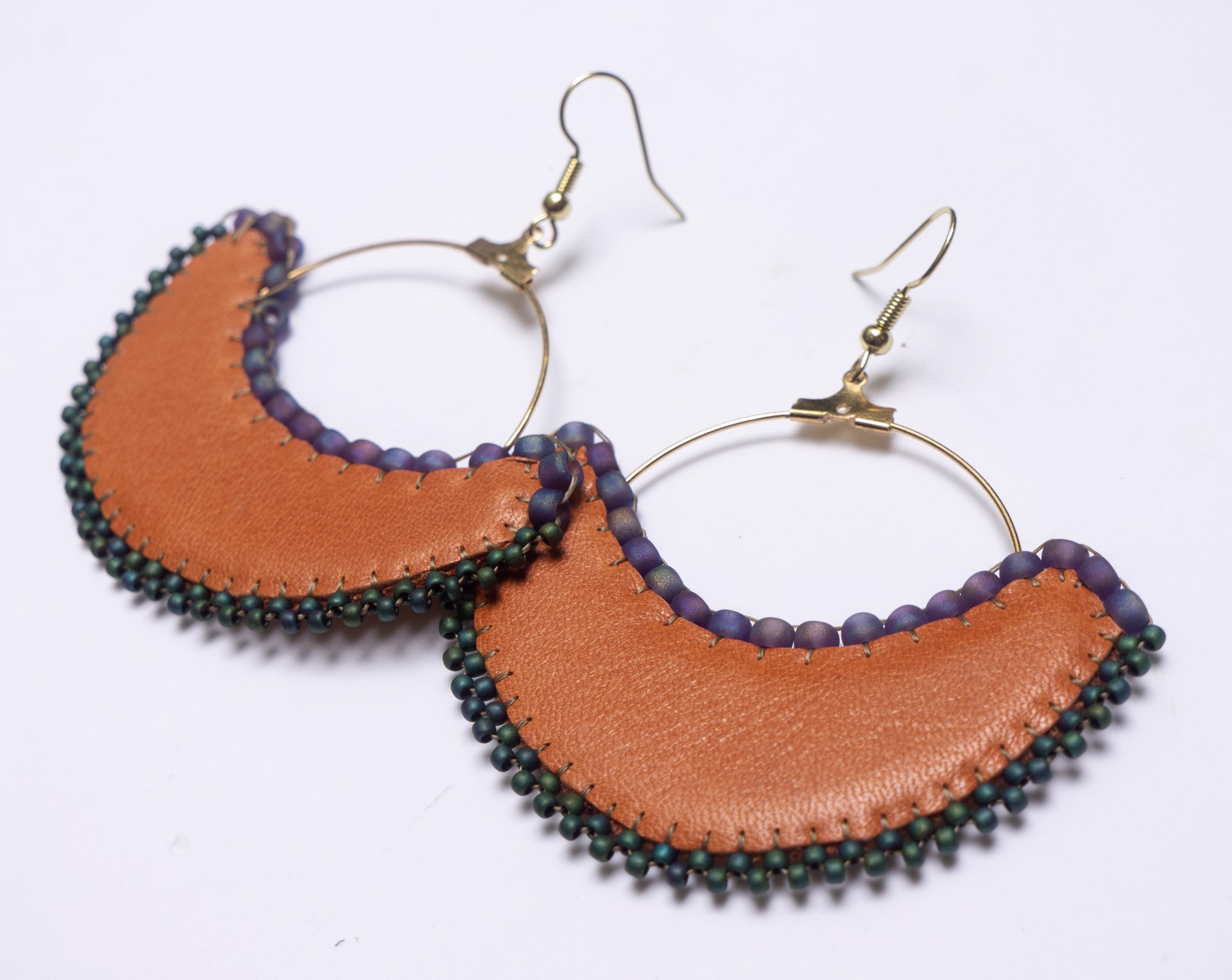 Leather and beaded hoops by Hattie Lee Mendoza