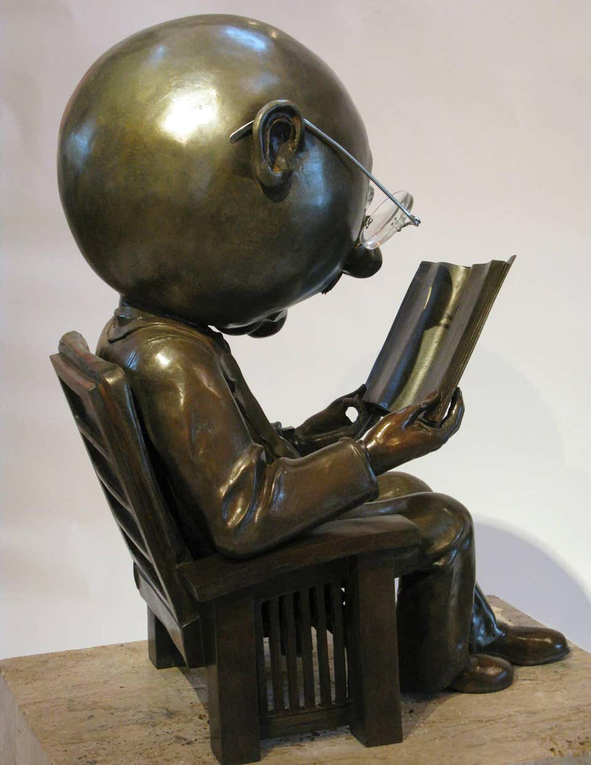 The Reader, bronze edition 12 by Rodger Jacobsen