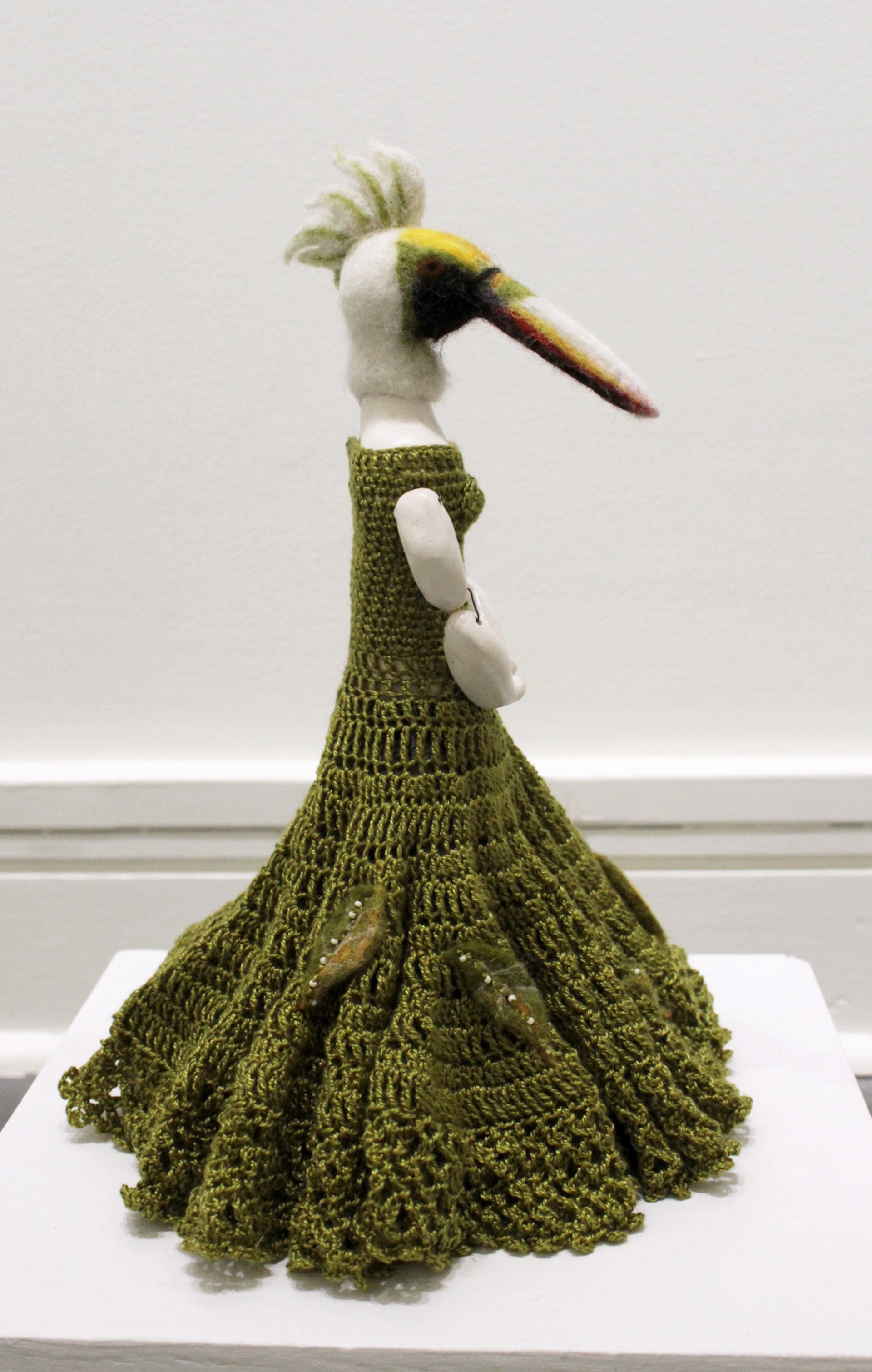Untitled (standing bird in green dress) by Eva Maier