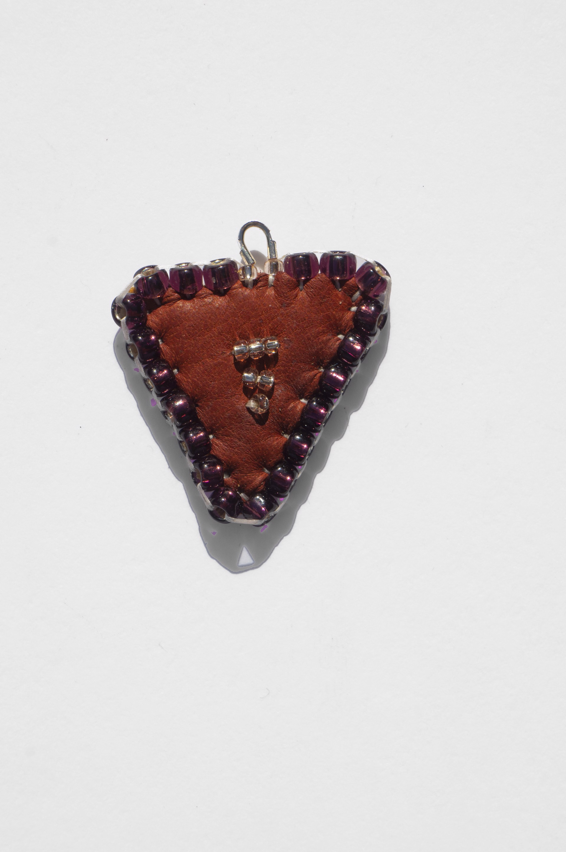 Beaded triangle pendant by Hattie Lee