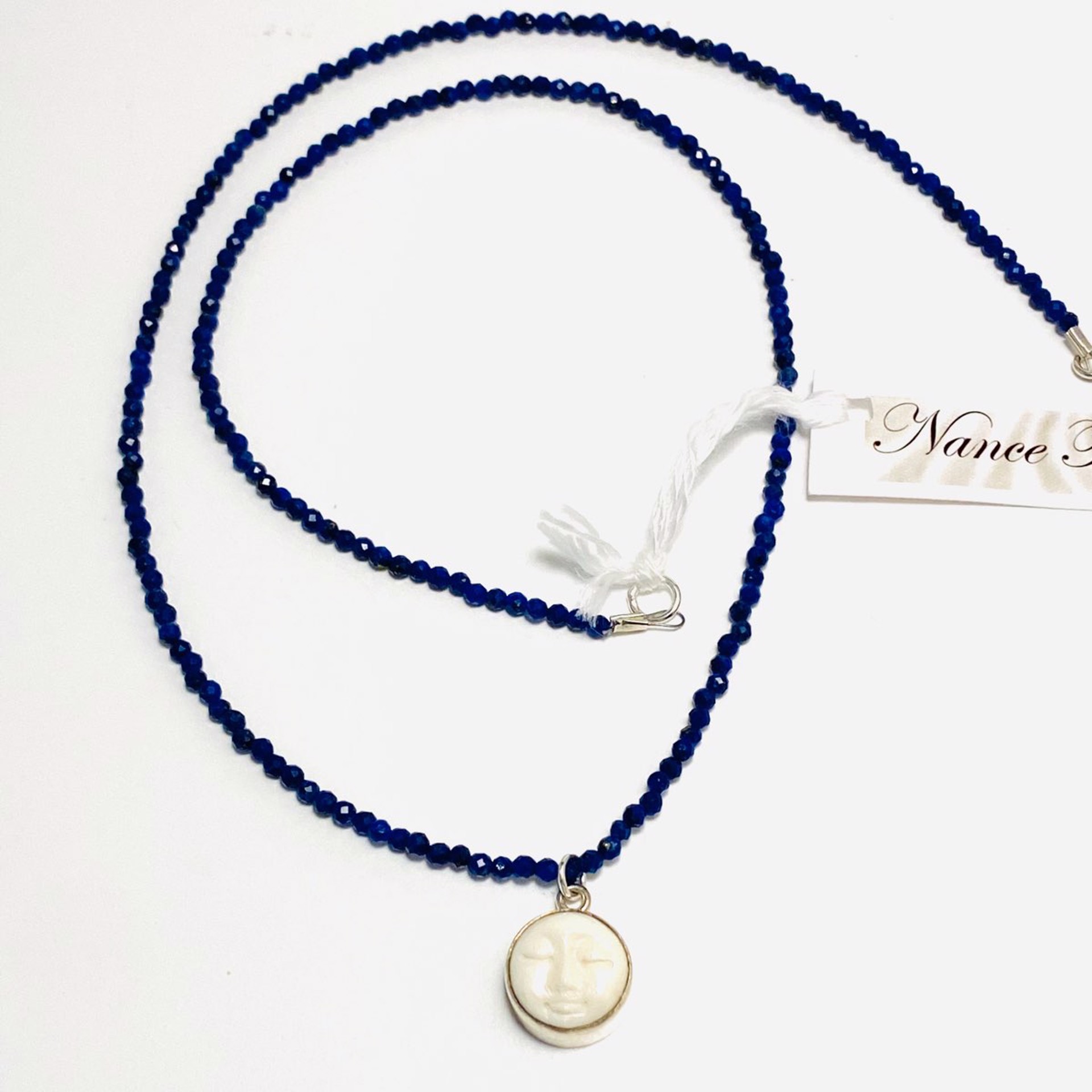 NT22-178 Tiny Faceted Lapis  Carved Bone Moon Face Charm Necklace by Nance Trueworthy