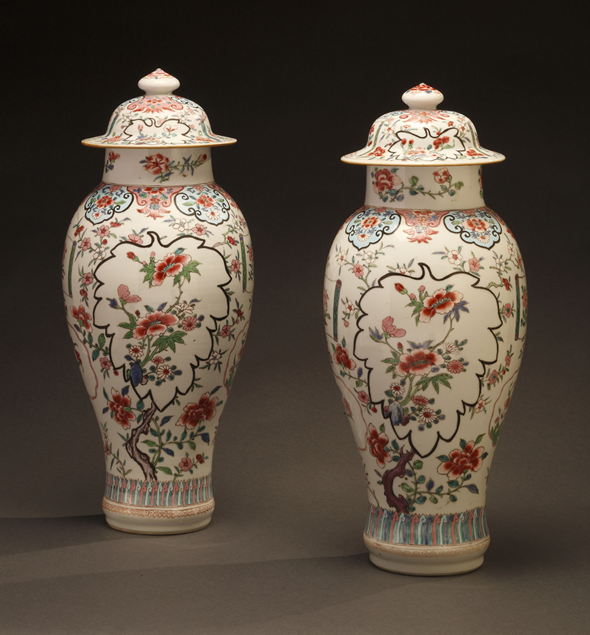 PAIR OF FAMILLE ROSE VASES AND COVERS