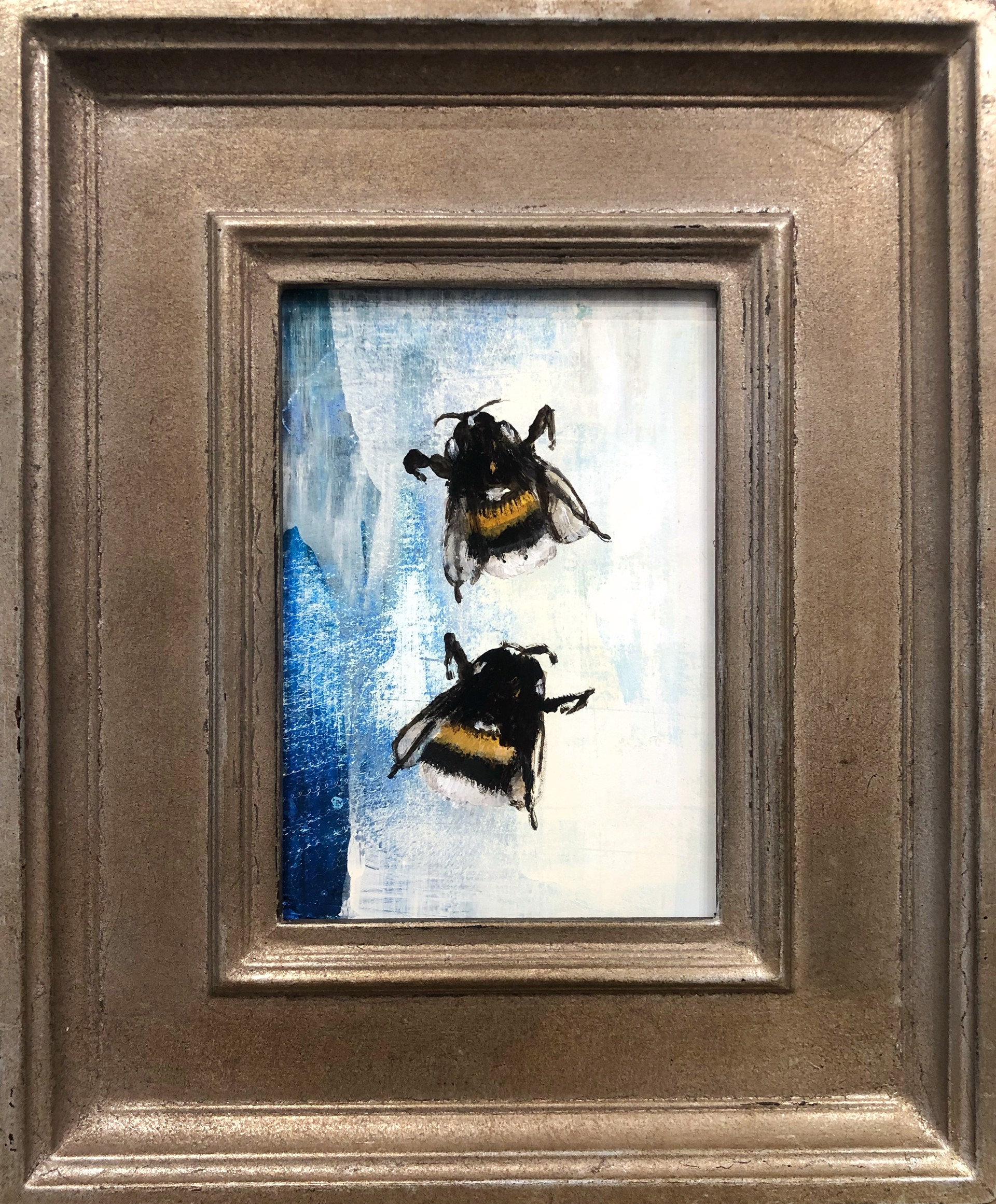 Original Oil Painting Of Two Bumble Bees On A Abstract Blue NA White Background With A Warm Silver Frame By Jenna Von Benedikts