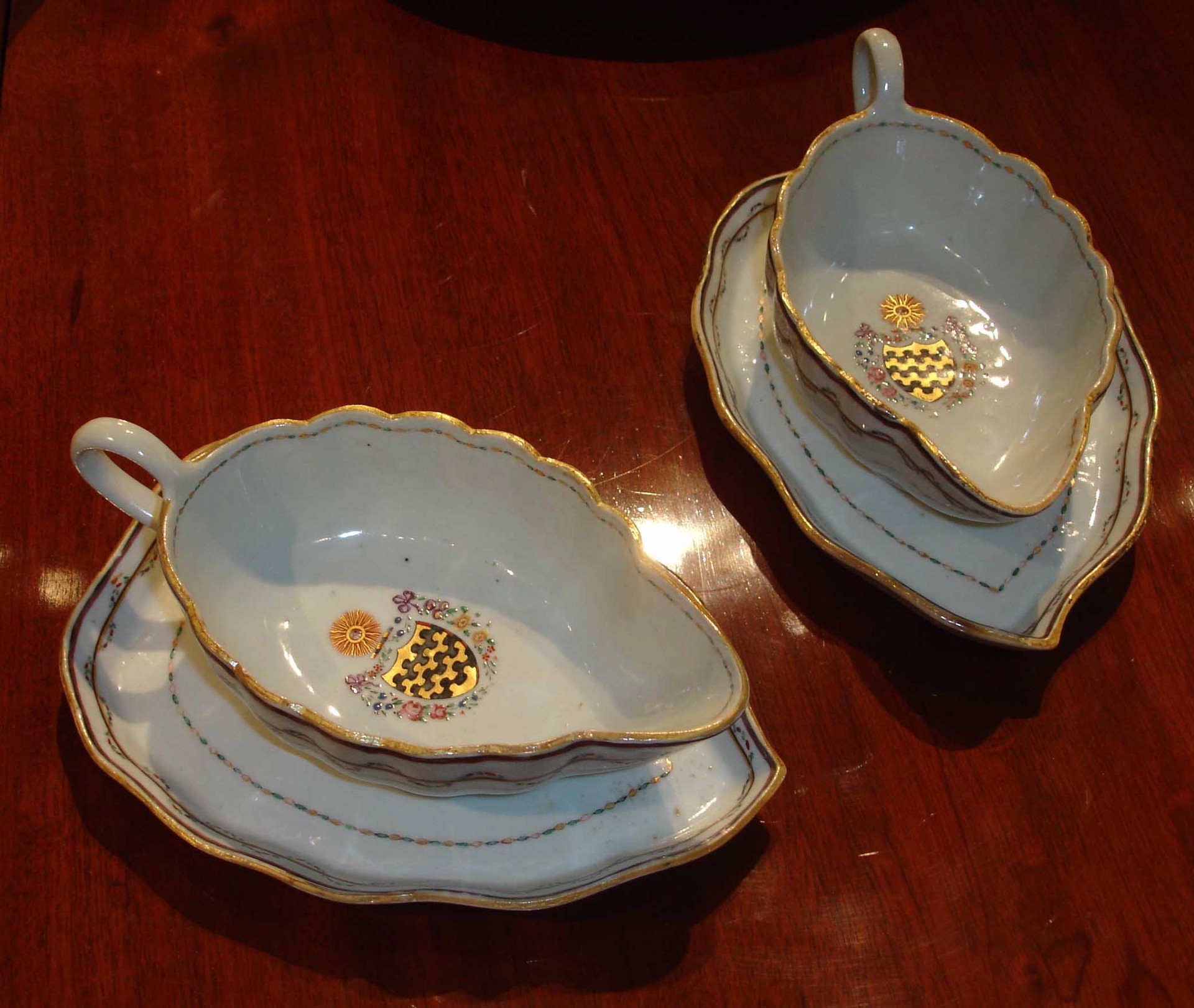 PAIR OF ARMORIAL GRAVY BOATS ON STANDS WITH ARMS OF BLUNT