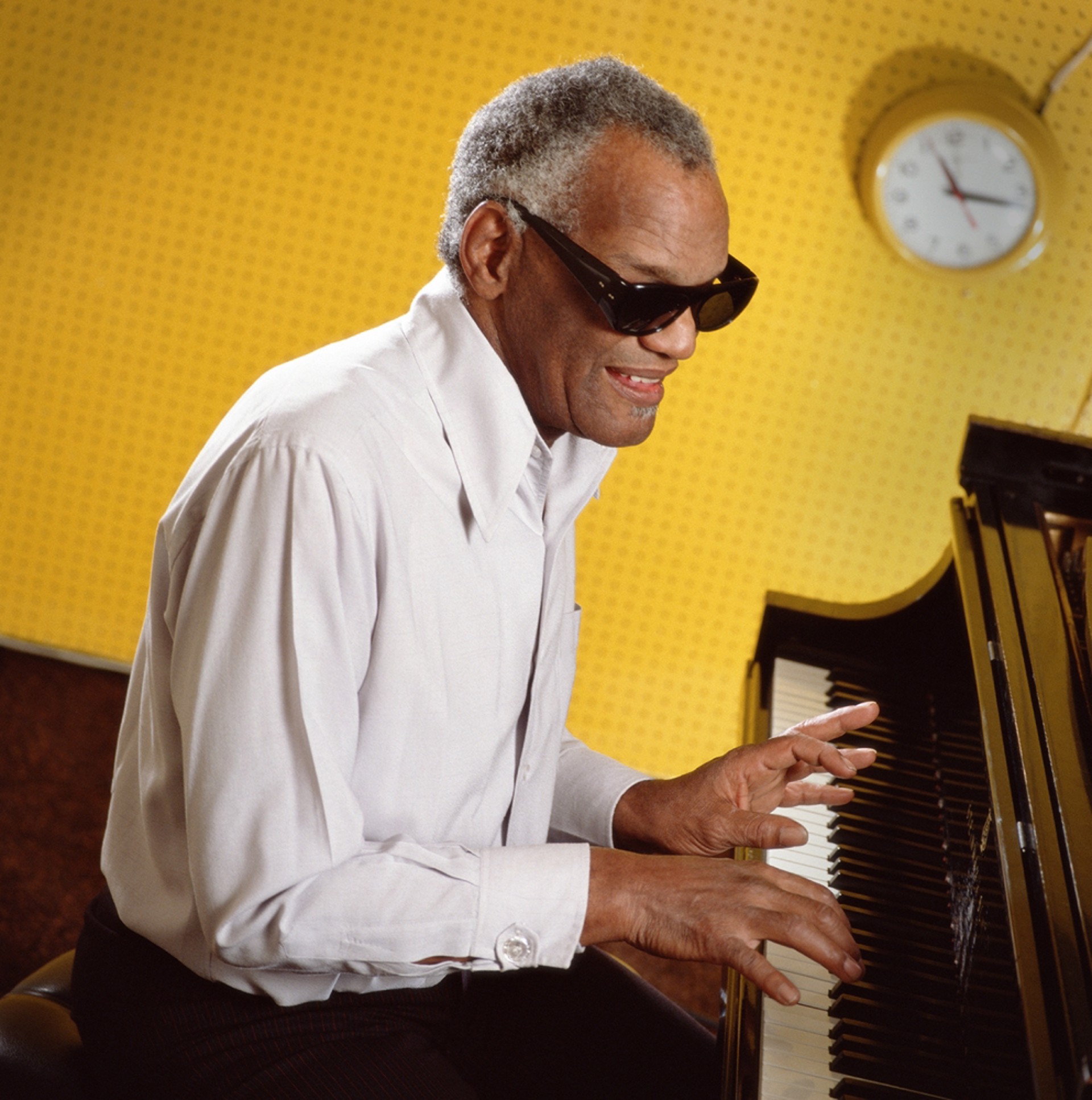 88097 Ray Charles Playing Piano Against Yellow Color by Timothy White
