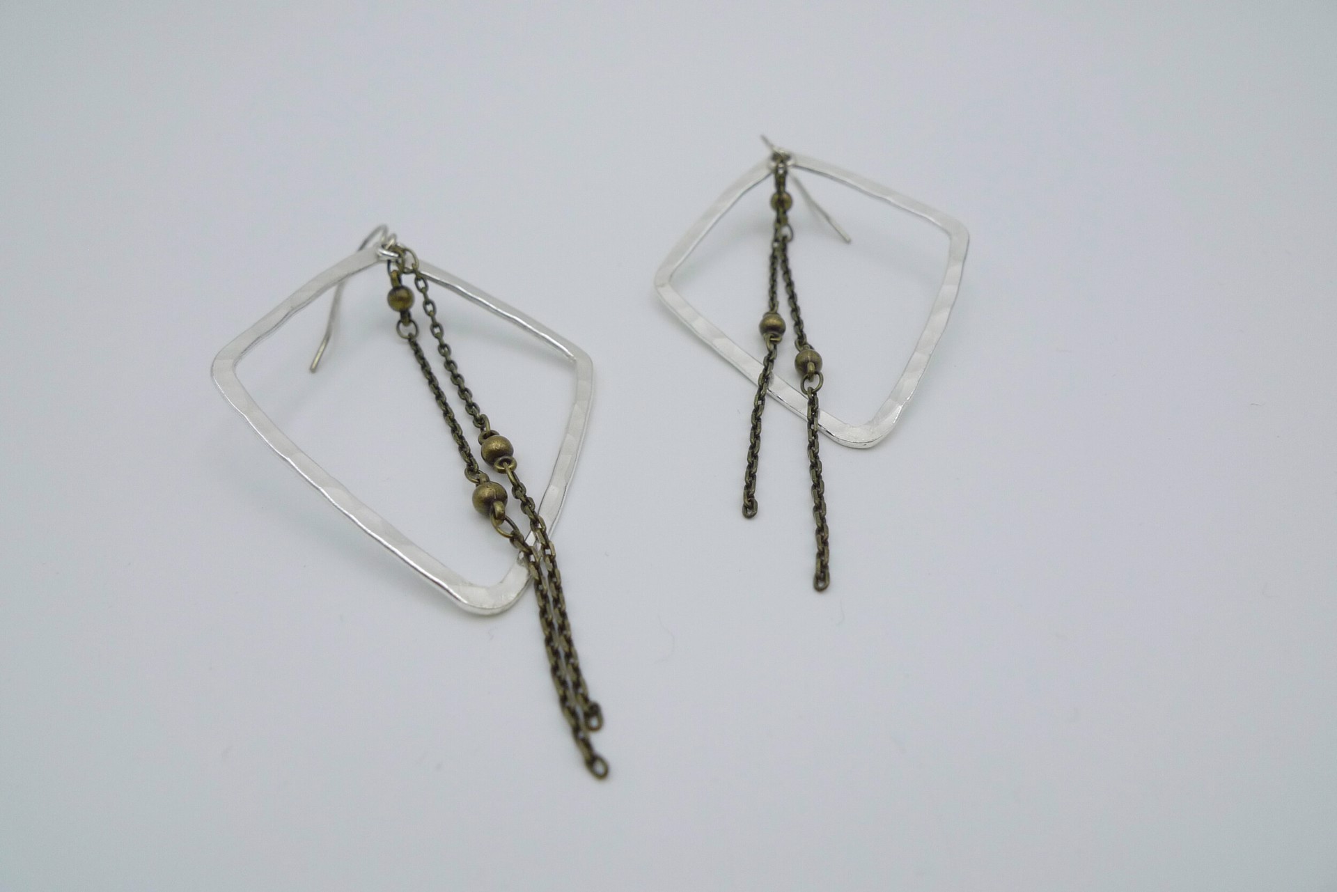Silver Diamond Shape Earrings by Mary Garrett