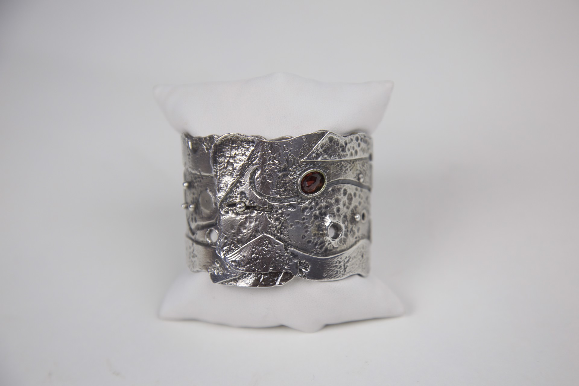Sterling silver and faceted garnet cuff by Jeri Mitrani