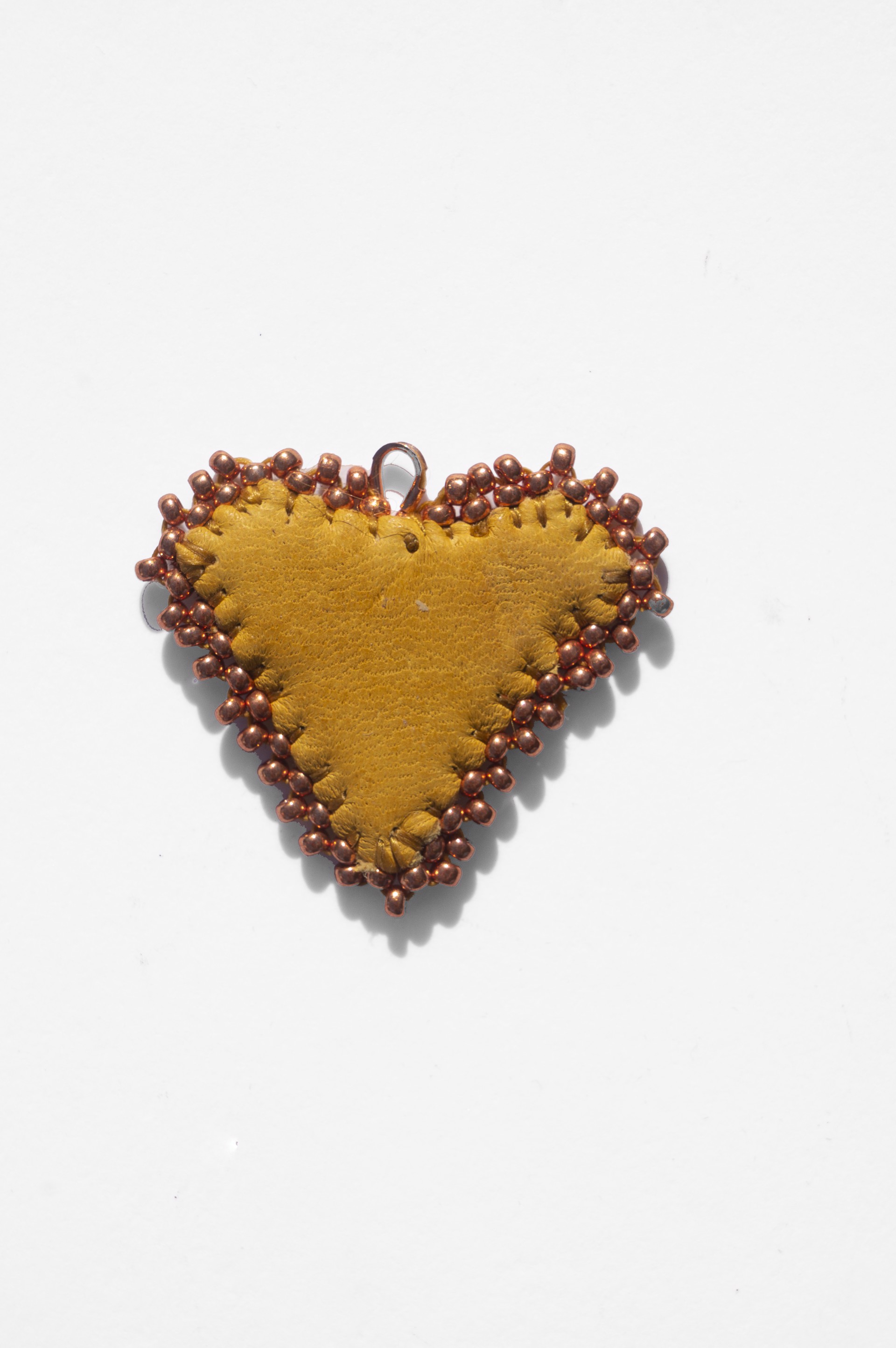 Reversible leather heart pendant by Hattie Lee