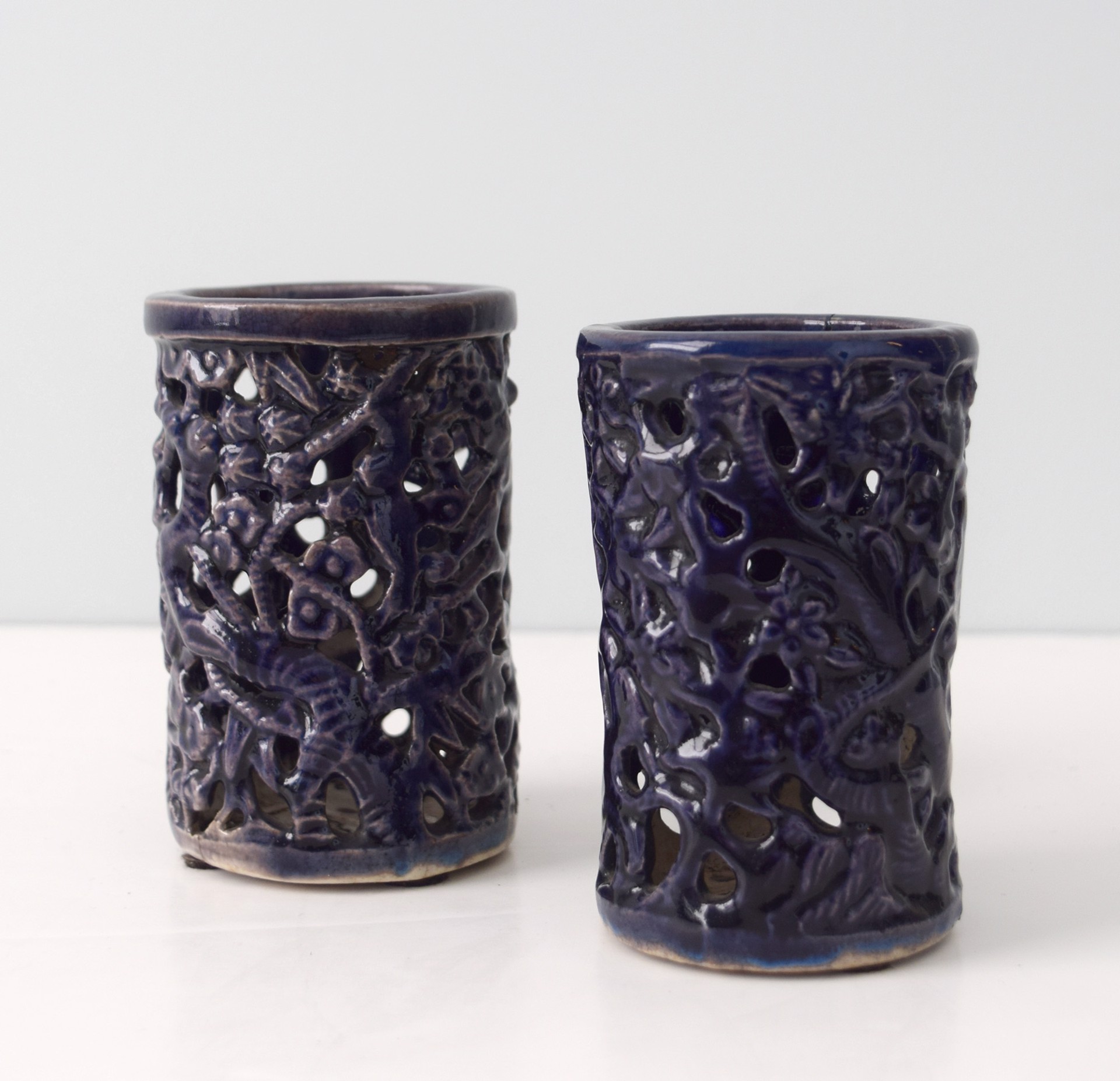 PAIR OF SMALL AUBERGINE RETICULATED BRUSHPOTS WITH BRANCHES