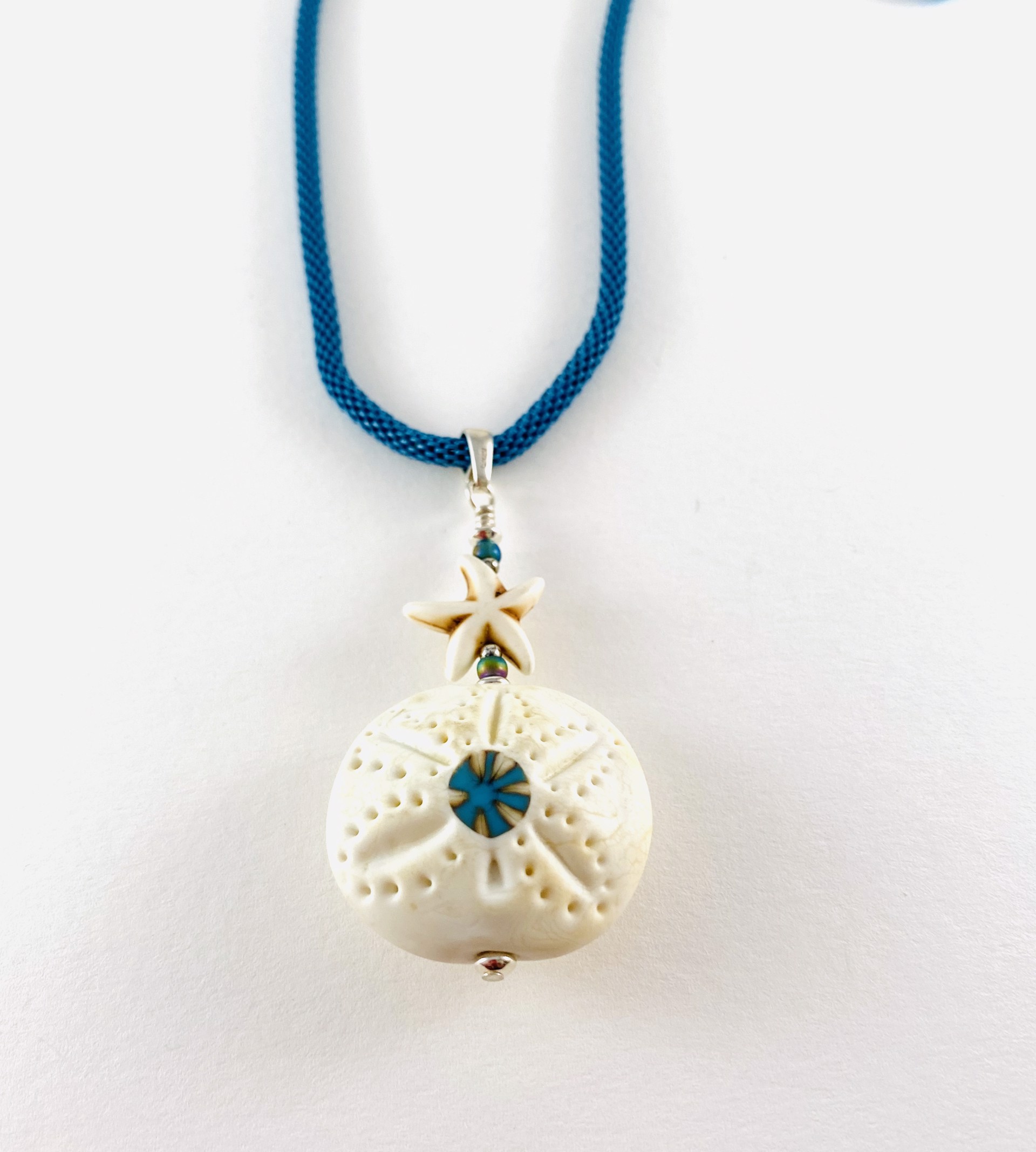 #378 Sand Dollar with Murrini Starfish Pendant, sterling findings, mesh chain  by Linda Sacra