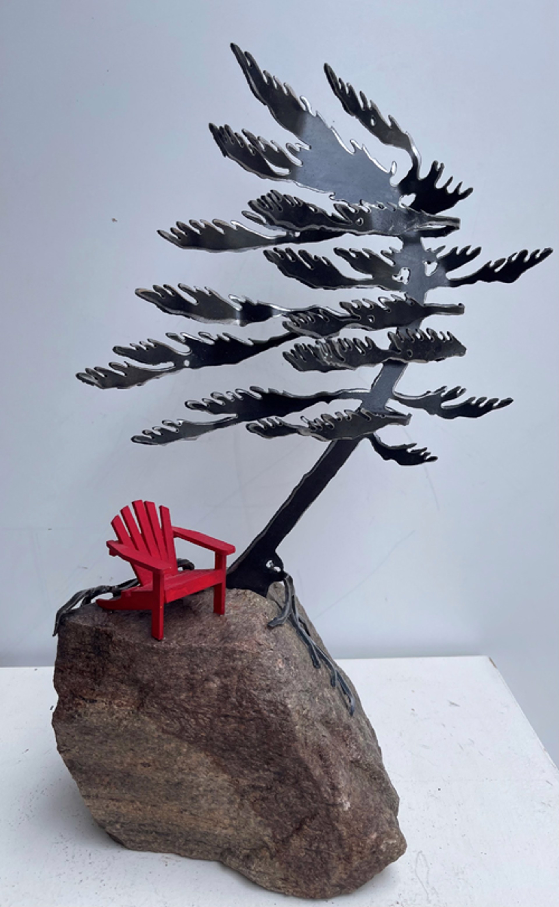 One Tree on Rock with Chair by Cathy Mark