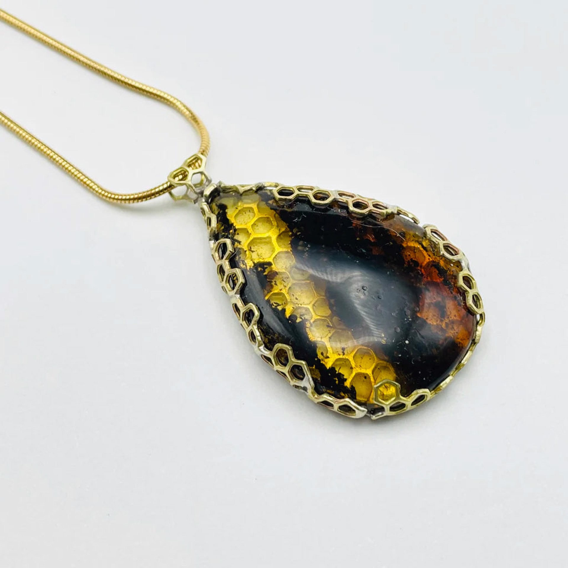 Amber Brass Honeycomb wrap pendant by Bee Amour