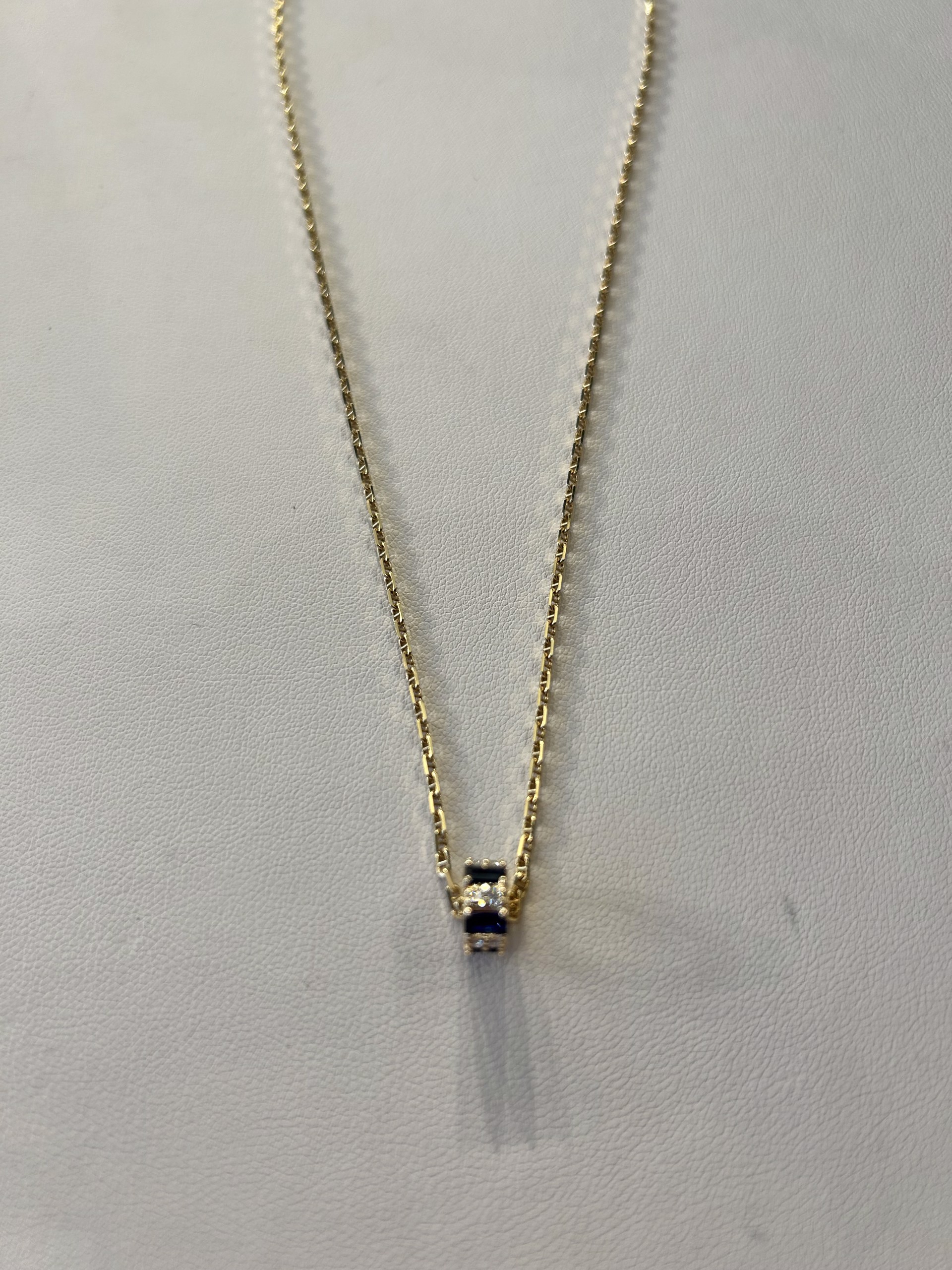 KB-N27 14 k gold necklace with a gold, diamond, and sapphire slide pendant by Karen Birchmier