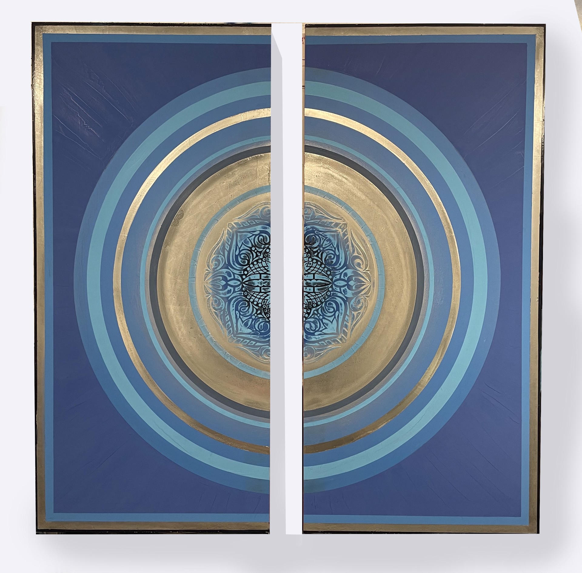 California artist and painter Stephanie Paige's painting Arya is a beautiful diptych made of two wood panels with layers of blue marble plaster paint and champagne circles.