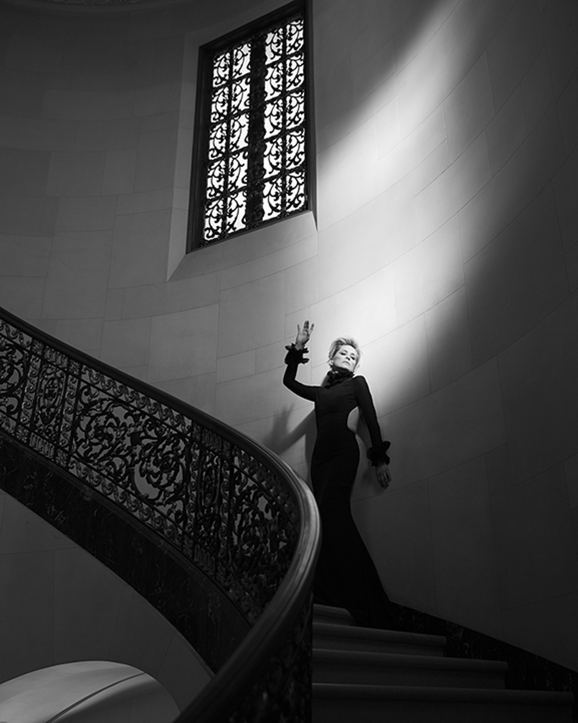 16004 Sharon Stone Against Wall on Staircase BW by Timothy White