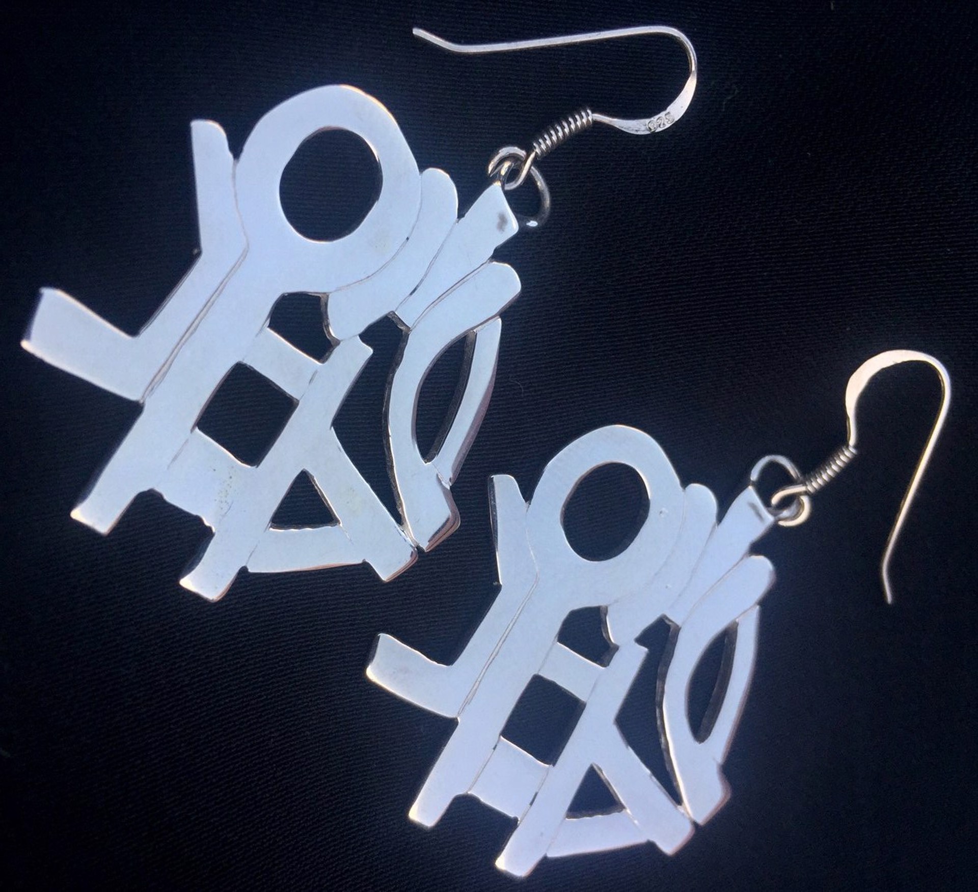 Thought Symbol Earrings by Robert Rogers