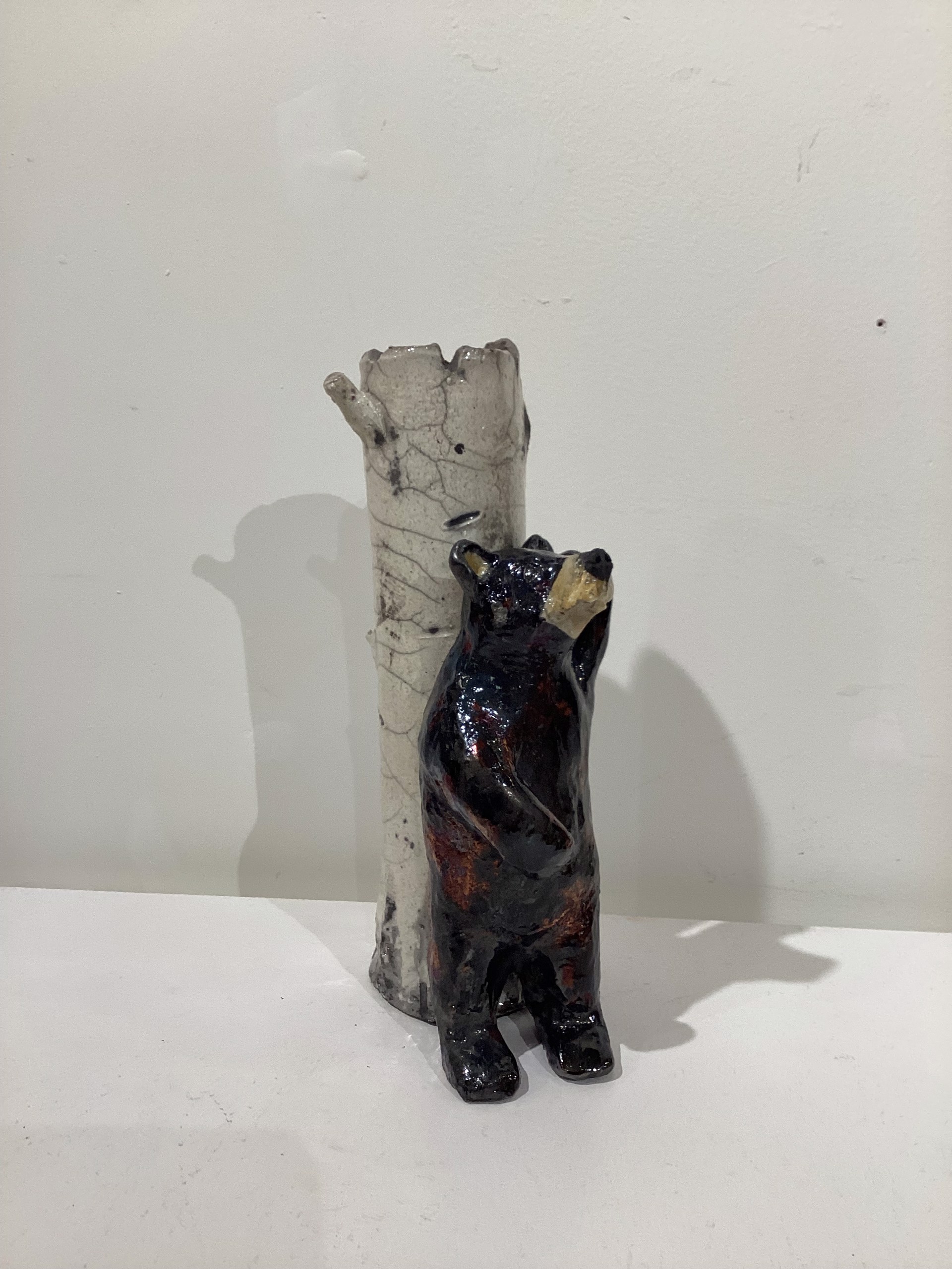 Black Bear Leaning Against Tree by Lisa Wilkinson