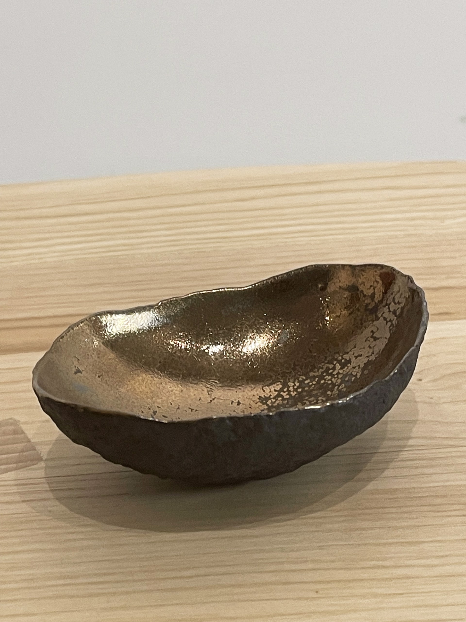 Small vessel with textured bronze glaze by Cristina Salusti
