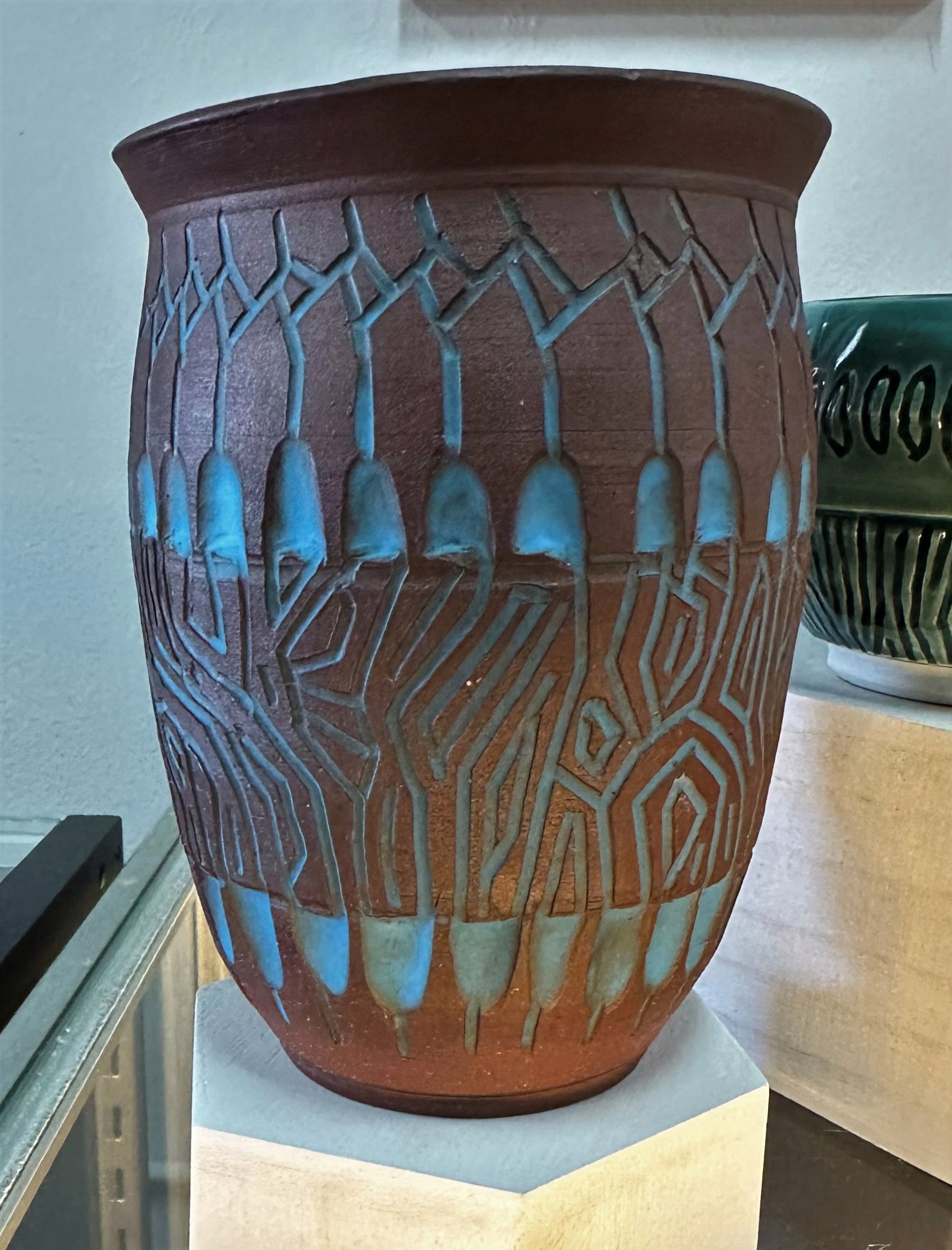 Carved red clay vase inlaid with blue glaze by James Adele Baxter