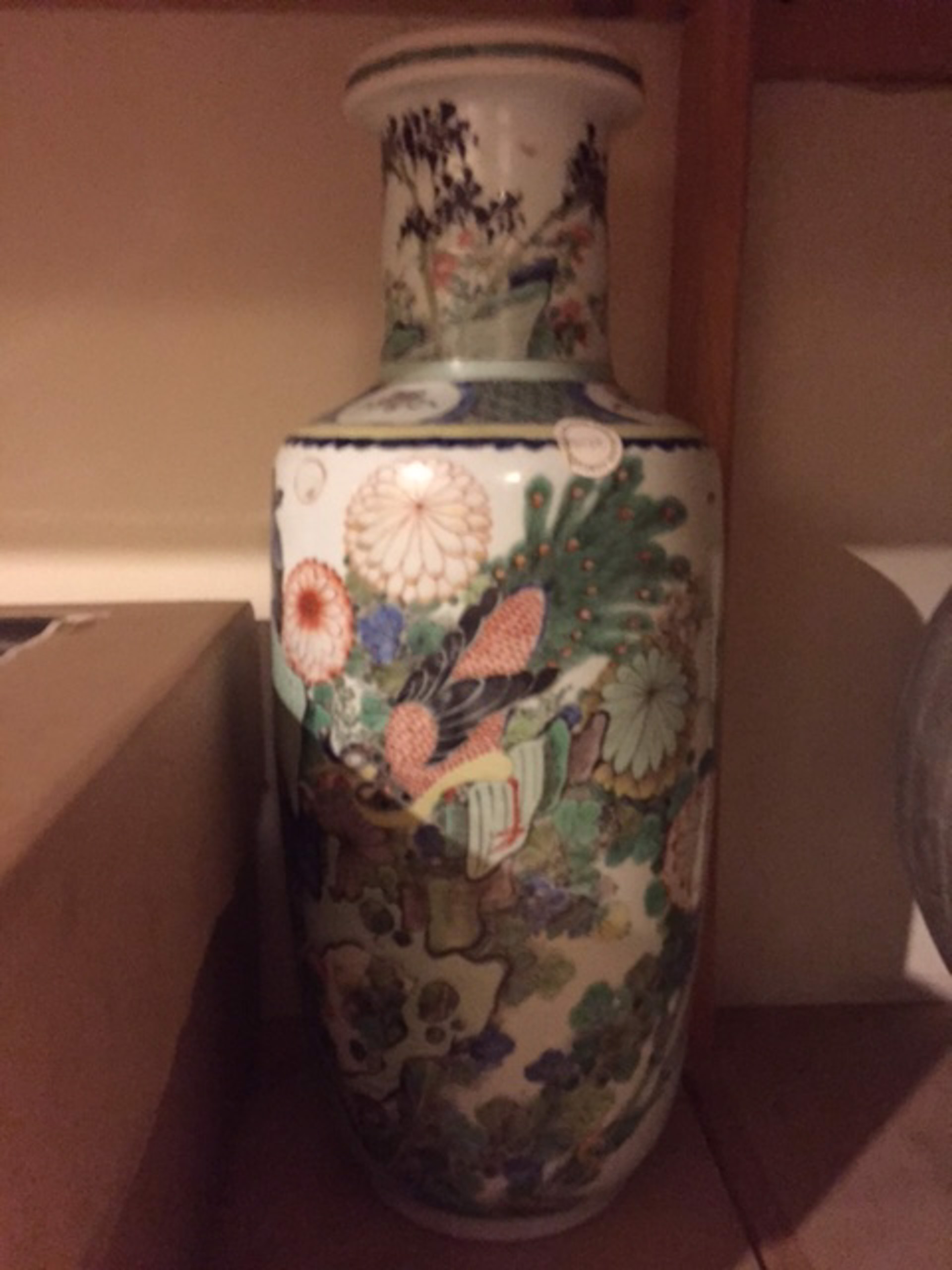 A LARGE FAMILLE VERTE ROULEAU FORM VASE WITH PEACOCK ON ROCKWORK