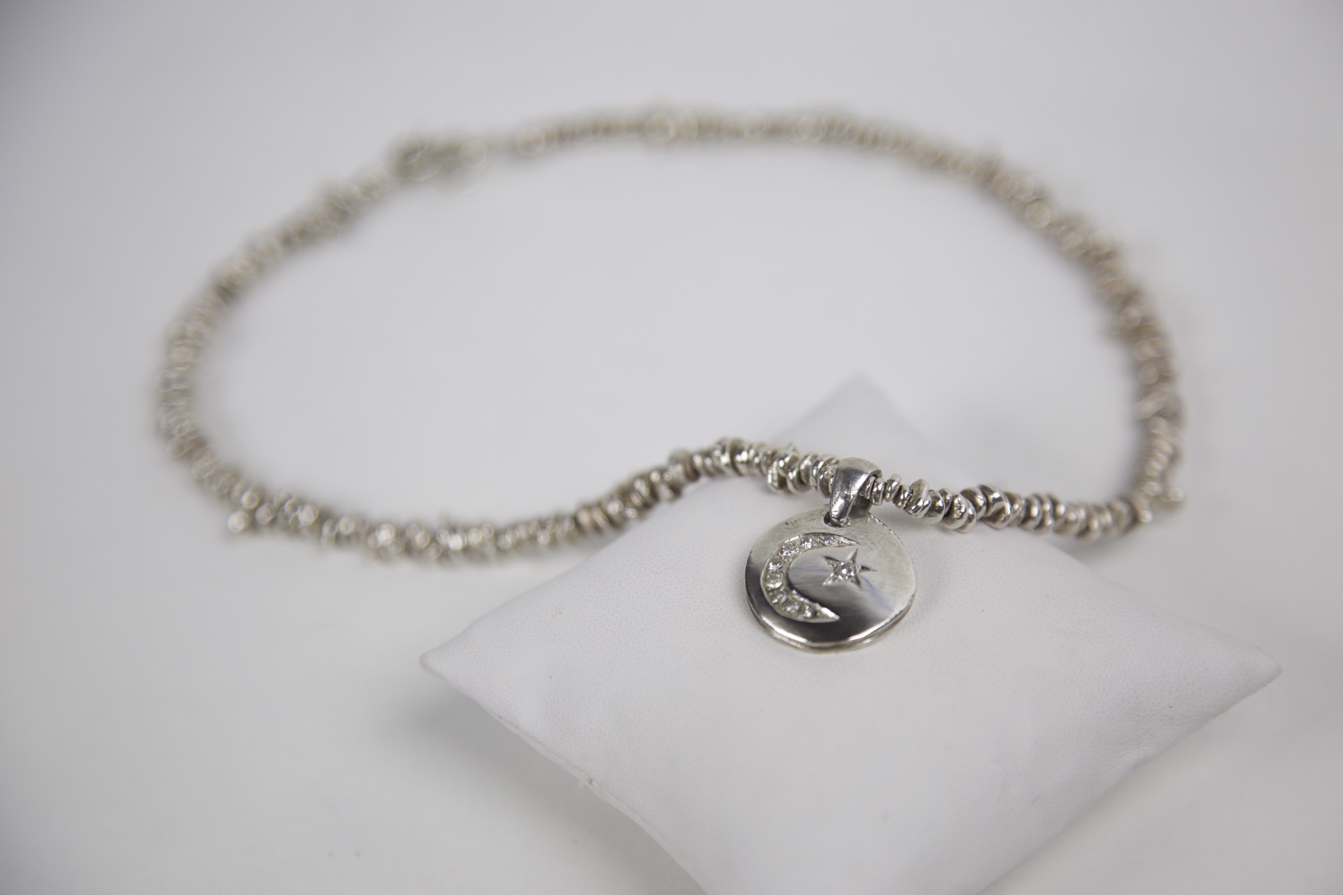 Sterling silver moon and star necklace, .35 carat diamonds by Jeri Mitrani