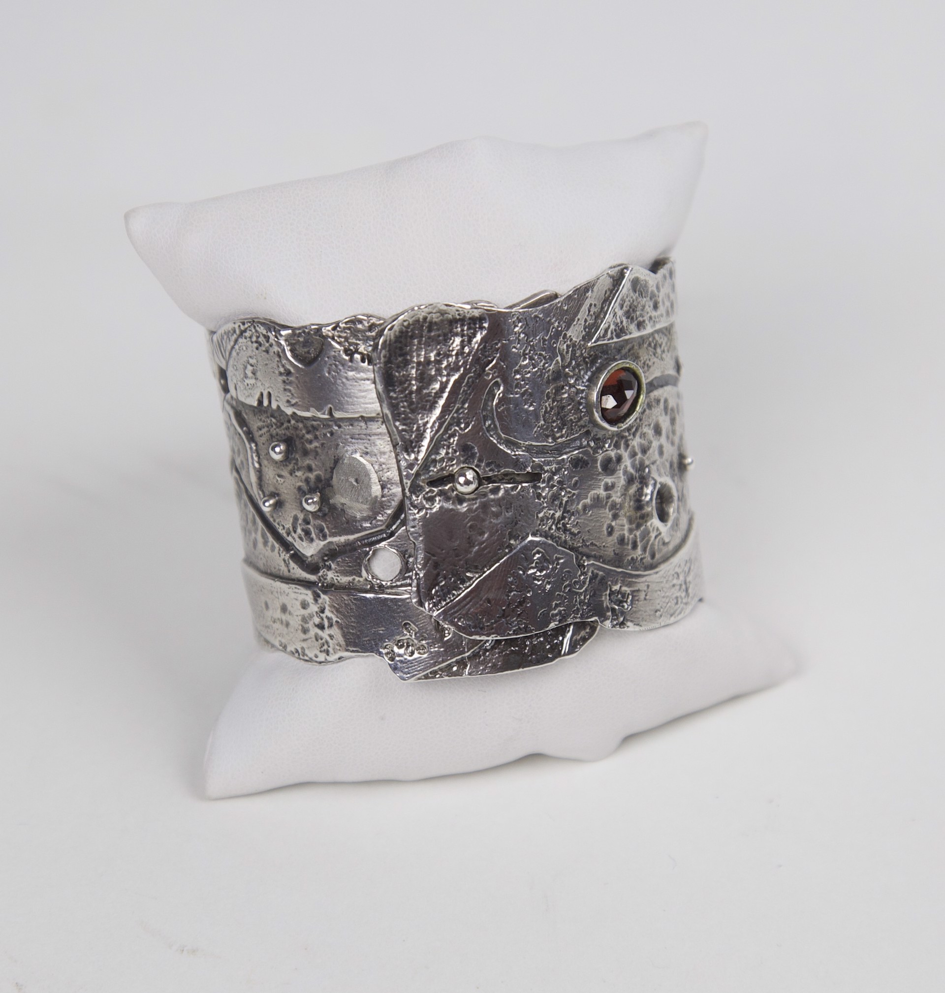 Sterling silver and faceted garnet cuff by Jeri Mitrani