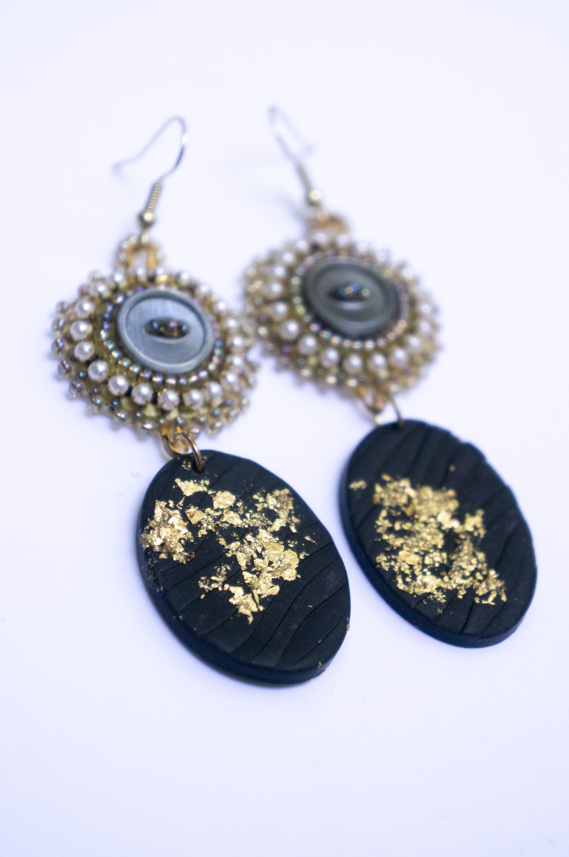 gold and black beaded earrings by Hattie Lee Mendoza