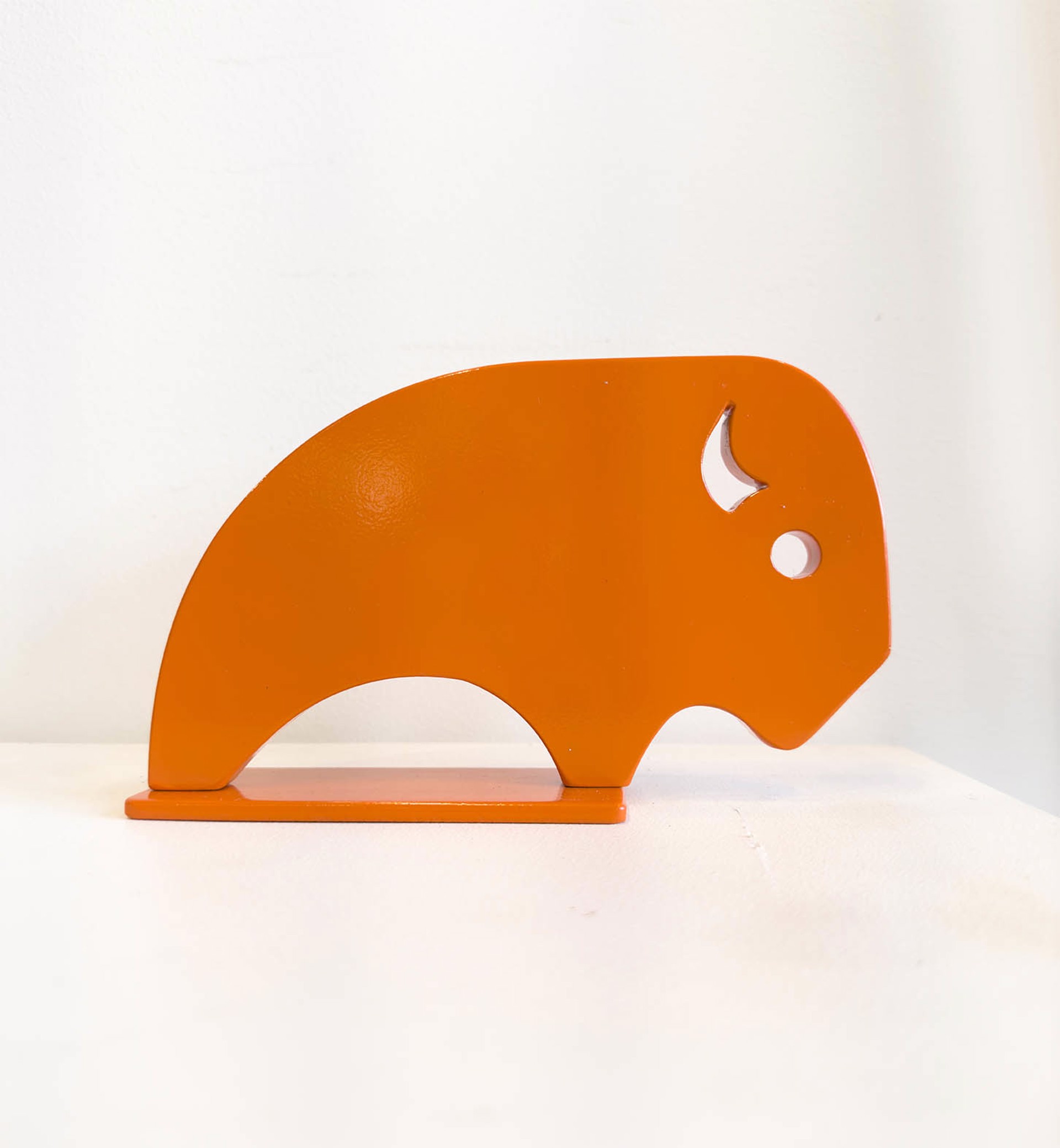 Miniature Aluminum Sculpture By Jeffie Brewer Featuring A Side Profile American Bison In Orange