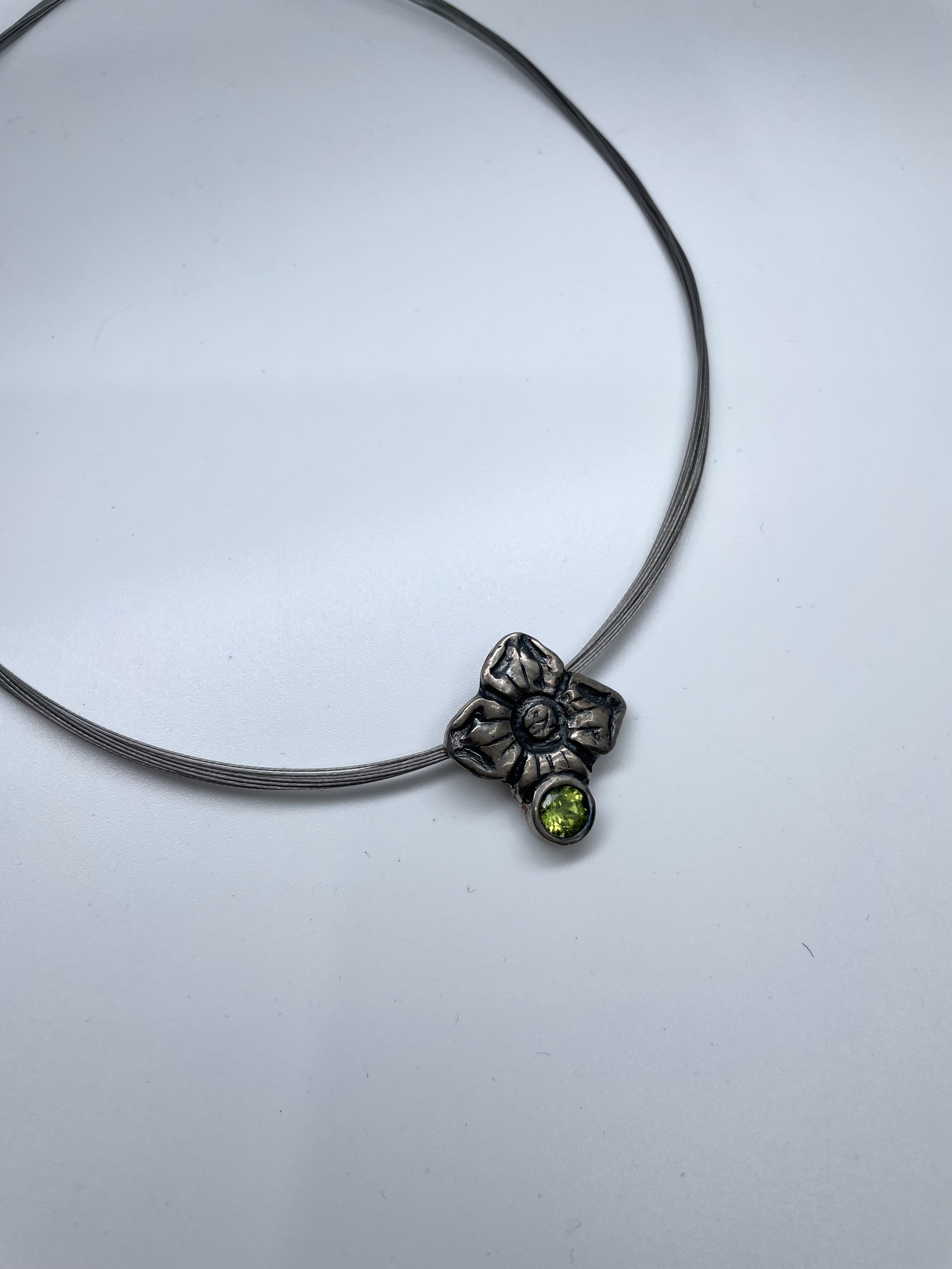 Wire Necklace with Silver Flower and Green Gem by Beth Benowich
