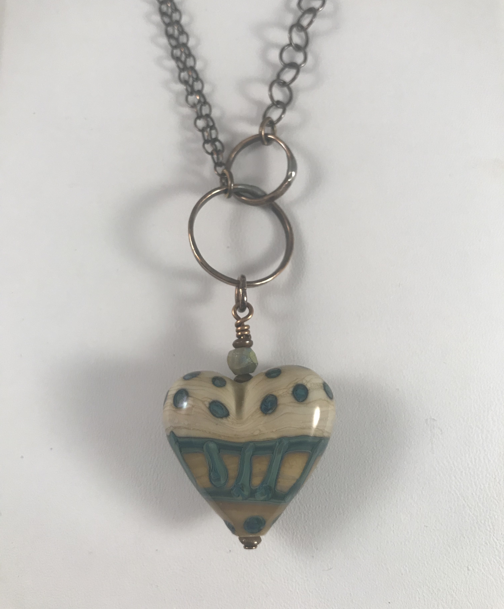 Ivory and Okanos Lampworked heart pendant on copper chain by Linda Sacra