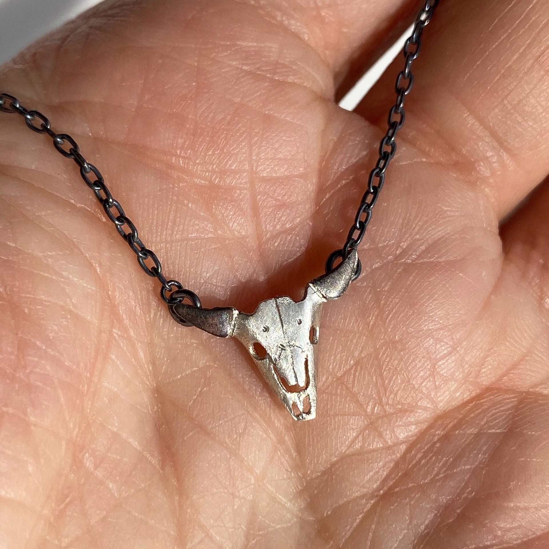 Tiny Buffalo Skull Necklace by Susan Elnora