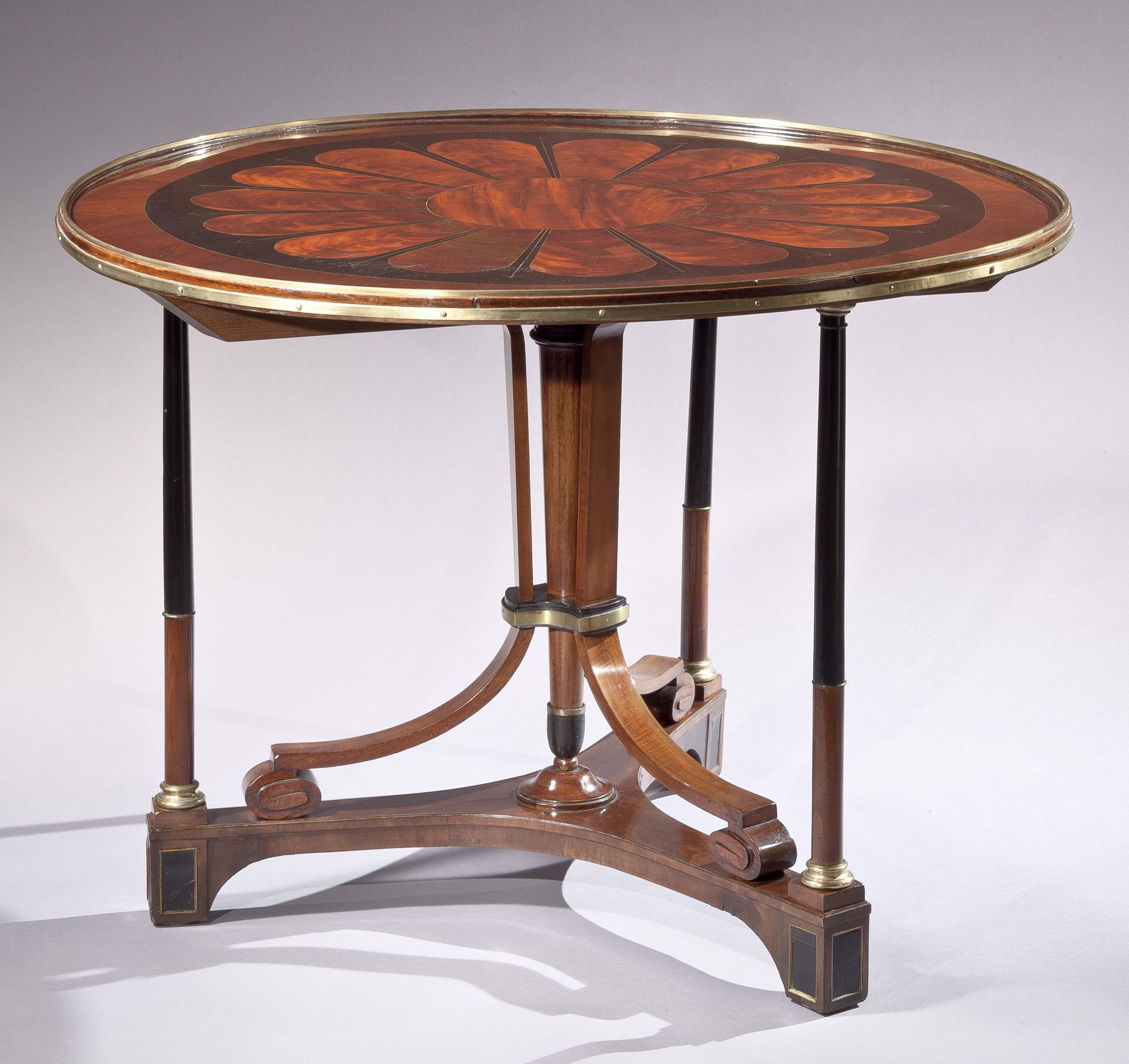 RUSSIAN NEOCLASSICAL STYLE BRASS-MOUNTED MAHOGANY AND EBONIZED CENTER TABLE 
