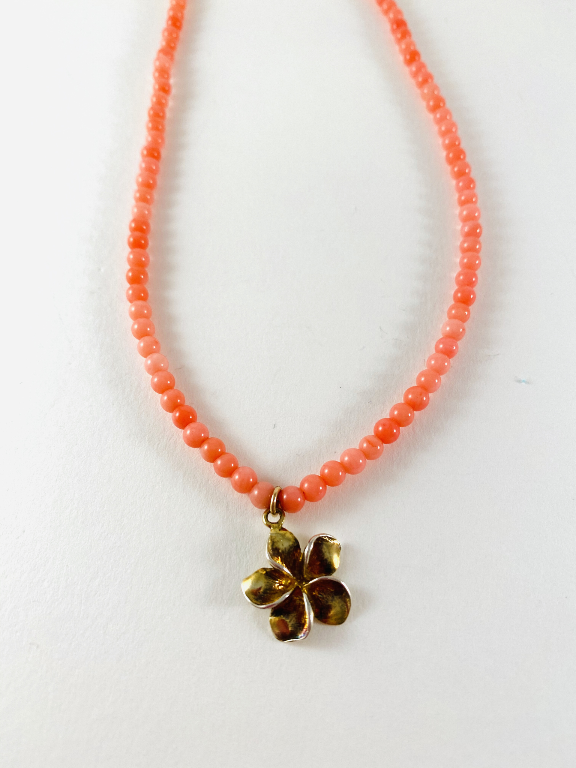 Coral Bead Necklace, vermeil flower charm by Nance Trueworthy