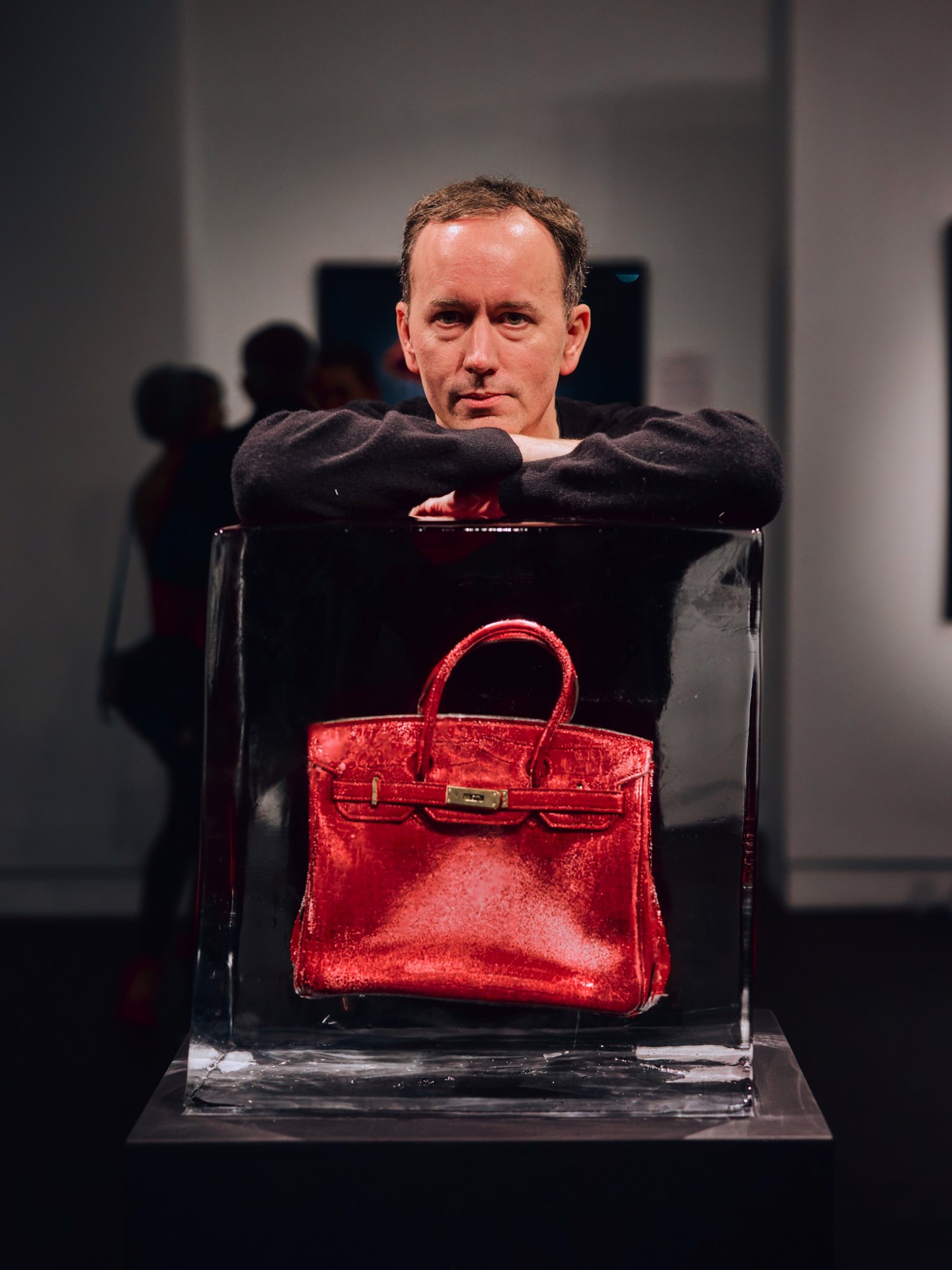 Tyler Shields behind the ice-encased red Hermès Birkin at Samuel Lynne Galleries, Dallas, October 17, 2026