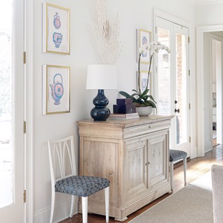 A paired set of small works by Cat Rigdon and a sculpture by Isabelle Coppinger add balance in this airy room. Designer: Caroline V. Smith Interiors, Photo: Ross Group Creative A paired set of small works by Cat Rigdon and a sculpture by Isabelle Coppinger add balance in this airy room. Designer: Caroline V. Smith Interiors, Photo: Ross Group Creative