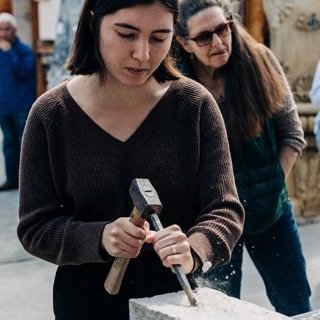 An attendee during the stone carving workshop An attendee during the stone carving workshop