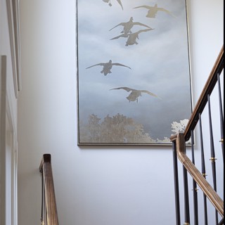 This Kurt Meer commissioned painting adds interest to a staircase landing. Photo: Ross Group Creative This Kurt Meer commissioned painting adds interest to a staircase landing. Photo: Ross Group Creative