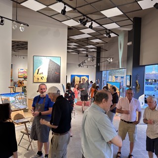 A lively crowd gathers at an art gallery, admiring paintings and sculptures. A lively crowd gathers at an art gallery, admiring paintings and sculptures.