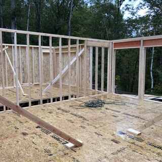 Walls up awaiting roof trusses. Walls up awaiting roof trusses.
