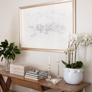 This Carroll Cloar study looks perfectly at home over this console table. Design: Sarah Spinosa Designs, Photo: Ross Group Creative This Carroll Cloar study looks perfectly at home over this console table. Design: Sarah Spinosa Designs, Photo: Ross Group Creative