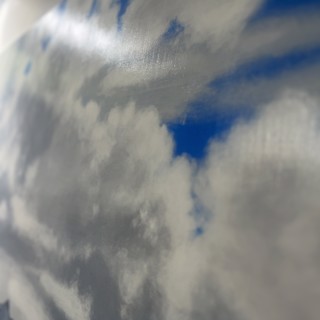 Lofty clouds and blue bird skies adorn the scenery in Isabella's painting. Lofty clouds and blue bird skies adorn the scenery in Isabella's painting.