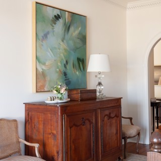 An Elise Morris canvas adds color to this welcoming entryway. Design: Caroline V. Smith Interiors, Photo: Ross Group Creative An Elise Morris canvas adds color to this welcoming entryway. Design: Caroline V. Smith Interiors, Photo: Ross Group Creative