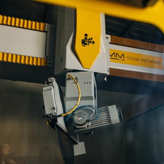Close up of CNC machine arm Close up of CNC machine arm