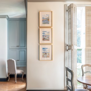 A trio of Phill Hopkins on paper works fit perfectly in this space. Designer: Miller Cowan and Rhea Crenshaw, Photo: Ross Group Creative A trio of Phill Hopkins on paper works fit perfectly in this space. Designer: Miller Cowan and Rhea Crenshaw, Photo: Ross Group Creative