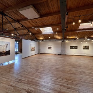 Continue the tour with an angled view, capturing the front-right section from Image 1 and the ensuing wall. This perspective enriches our understanding of the layout and spatial harmony within D'Ospina's compelling exhibition at Gallery 1261. Continue the tour with an angled view, capturing the front-right section from Image 1 and the ensuing wall. This perspective enriches our understanding of the layout and spatial harmony within D'Ospina's compelling exhibition at Gallery 1261.