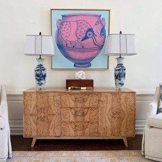 This Cat Rigdon work adds a splash of color and fun over this sideboard. Designer: Anna Lattimore Interior Design, Photo: Ross Group Creative This Cat Rigdon work adds a splash of color and fun over this sideboard. Designer: Anna Lattimore Interior Design, Photo: Ross Group Creative