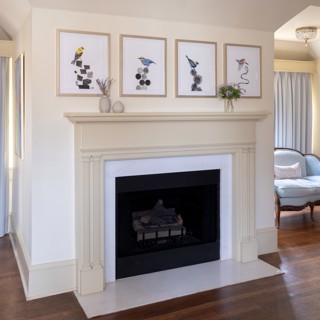 A series of Lauren Matsumoto's work adds a playful twist above the fireplace. Design: Elizabeth Malmo Interior Design, Photo: Ross Group Creative A series of Lauren Matsumoto's work adds a playful twist above the fireplace. Design: Elizabeth Malmo Interior Design, Photo: Ross Group Creative